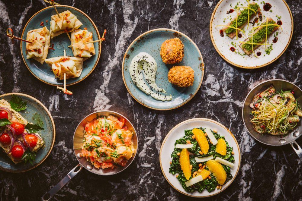 A delicious spread of food served at Suvlaki in Soho, one of the most romantic restaurants in London 